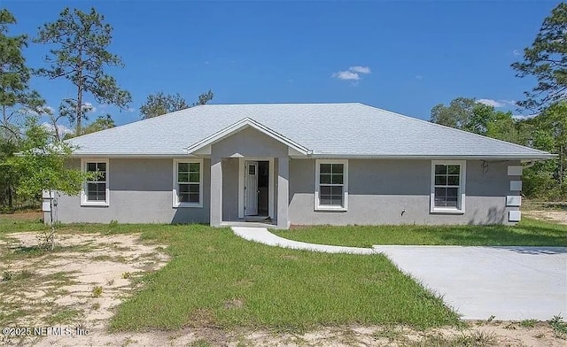 ranch-style house with a front yard