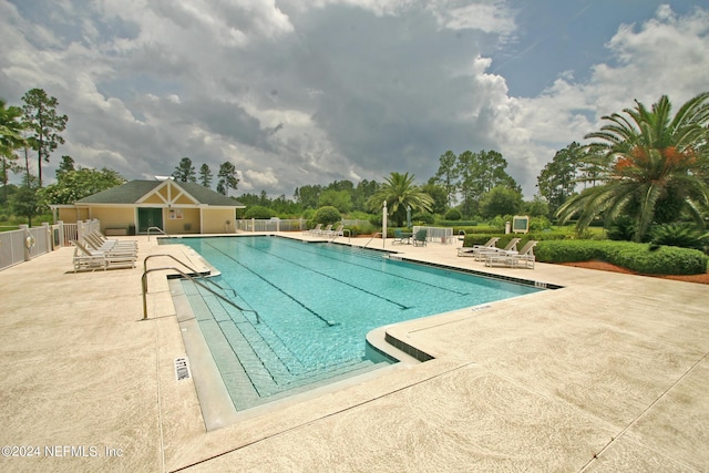 view of swimming pool with a patio