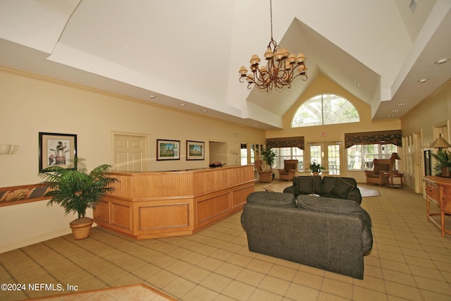 tiled living room featuring an inviting chandelier and a high ceiling