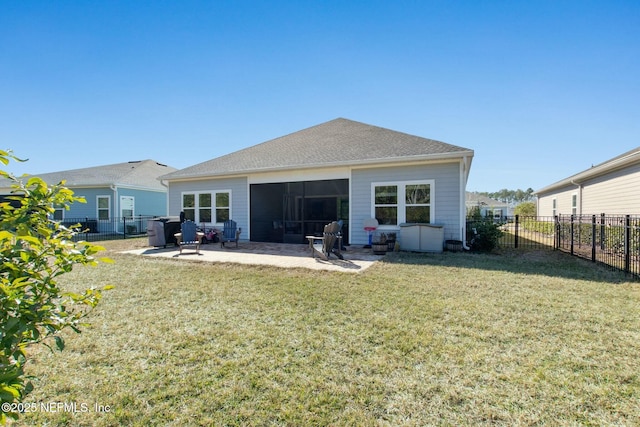 back of property featuring a lawn and a patio area