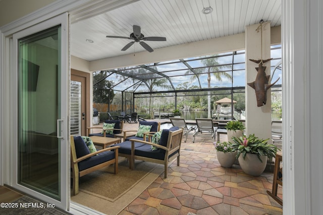 sunroom / solarium with ceiling fan and plenty of natural light