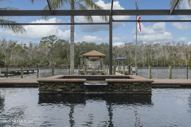 dock area featuring a gazebo and a water view