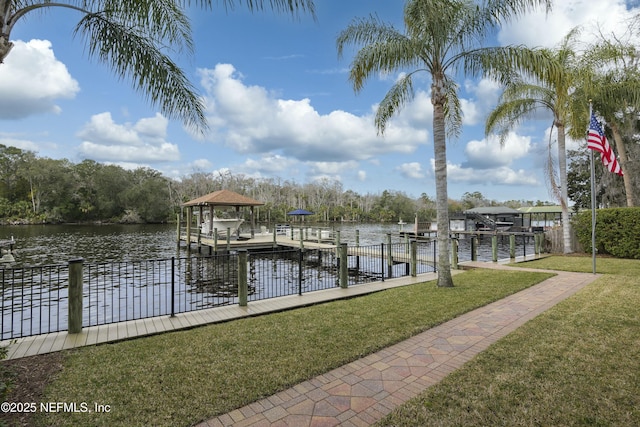 dock area featuring a yard and a water view