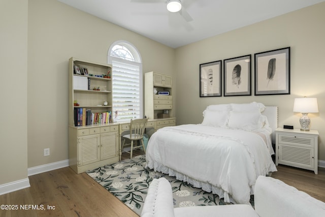 bedroom featuring dark hardwood / wood-style flooring and ceiling fan