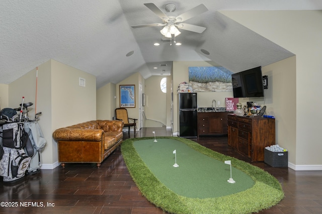 playroom with lofted ceiling, a textured ceiling, ceiling fan, and sink