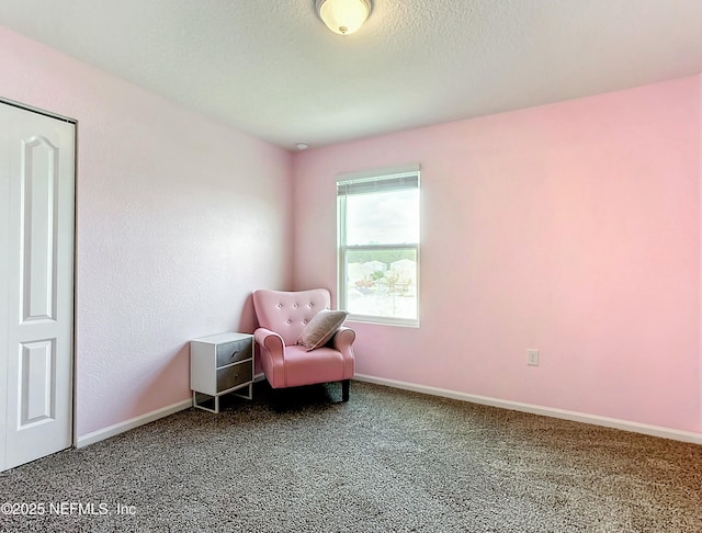 living area featuring carpet floors