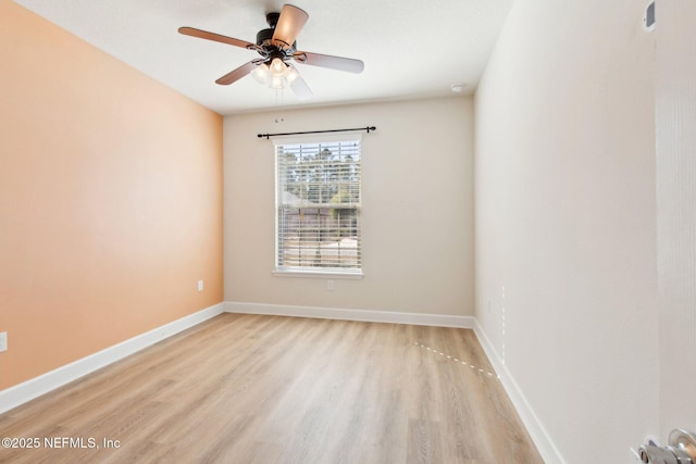 empty room featuring light wood-type flooring and ceiling fan