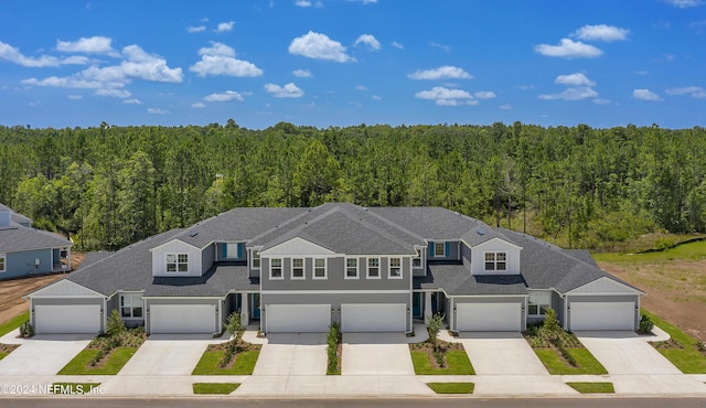 townhome / multi-family property featuring a garage