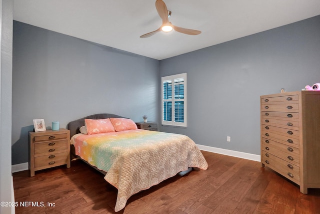 bedroom featuring ceiling fan and dark hardwood / wood-style floors