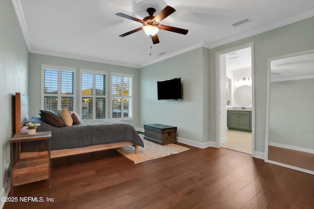 bedroom with connected bathroom, sink, dark hardwood / wood-style floors, ornamental molding, and ceiling fan