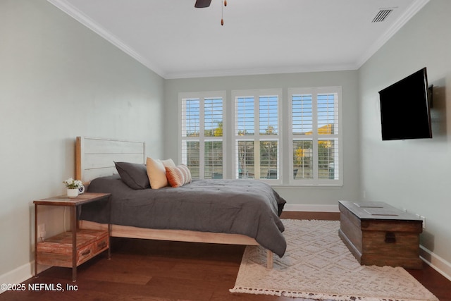 bedroom with ceiling fan, crown molding, and hardwood / wood-style flooring