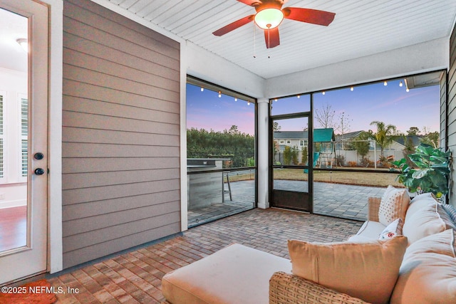 sunroom / solarium with ceiling fan