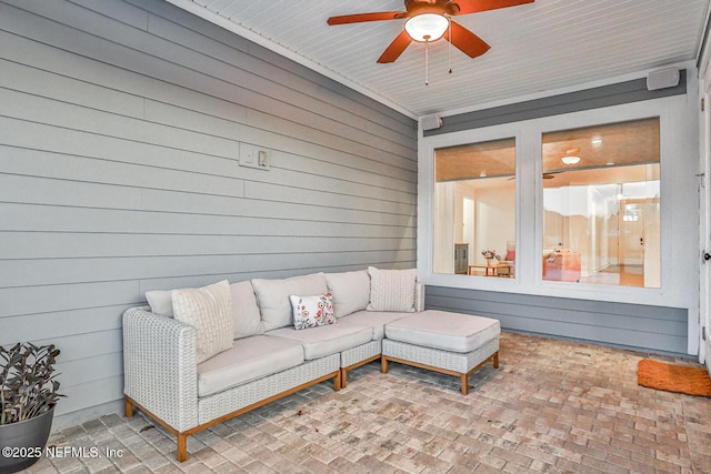 exterior space featuring ceiling fan