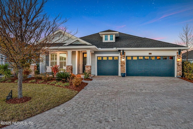 view of front of house featuring covered porch and a garage