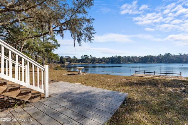 wooden deck with a water view