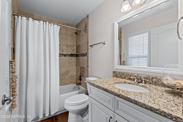 full bathroom with toilet, shower / tub combo, hardwood / wood-style floors, and vanity