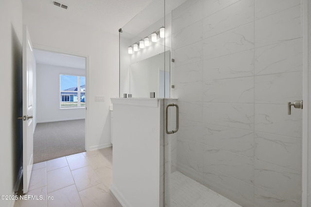 bathroom featuring an enclosed shower and vanity