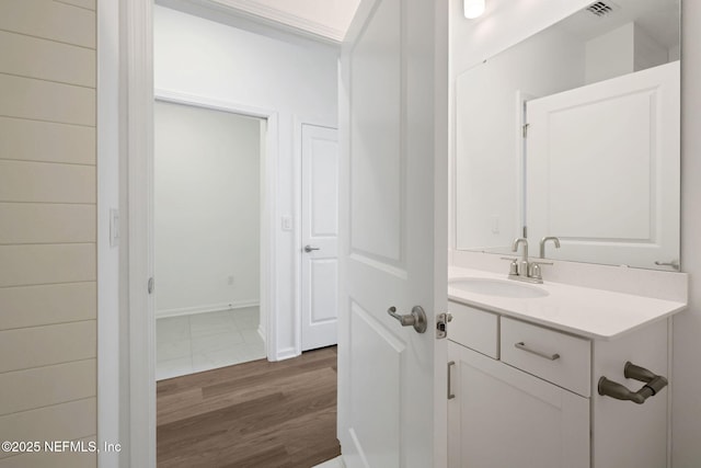 bathroom with vanity and wood-type flooring