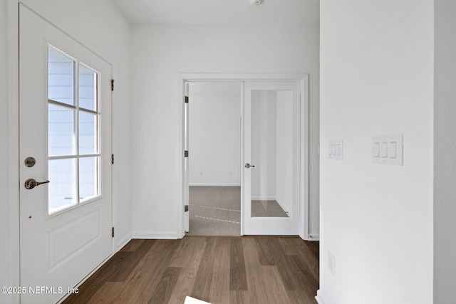 entryway with hardwood / wood-style flooring and french doors