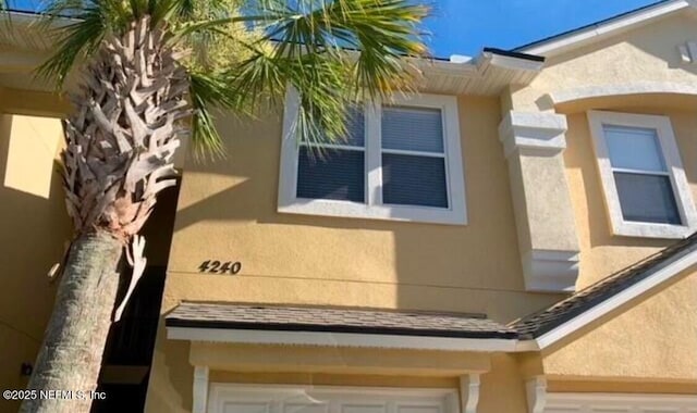 view of side of property with a garage