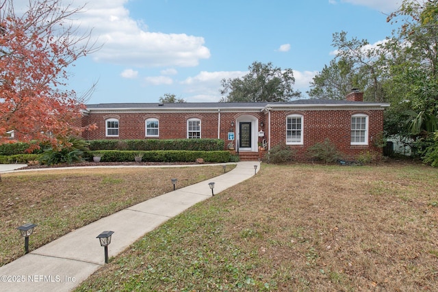 view of front of property with a front lawn