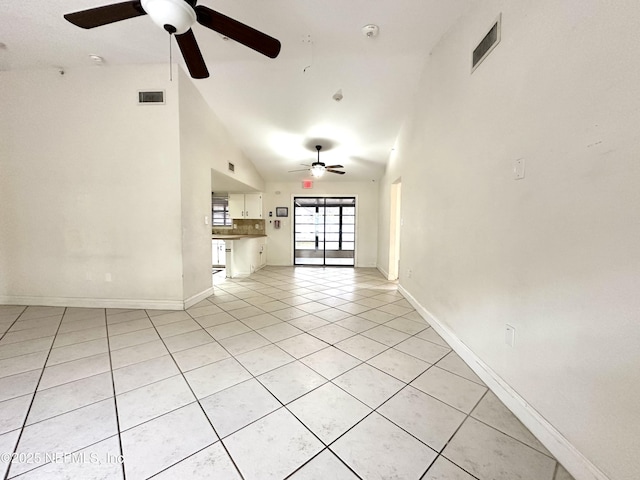 unfurnished living room featuring ceiling fan, light tile patterned floors, and lofted ceiling