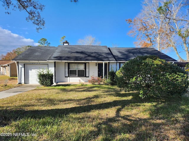 ranch-style house featuring a front yard and a garage