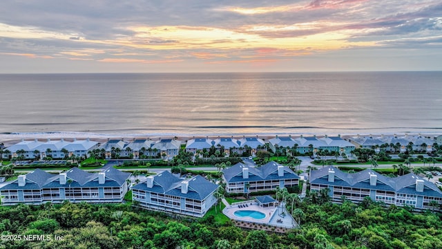 aerial view at dusk with a water view