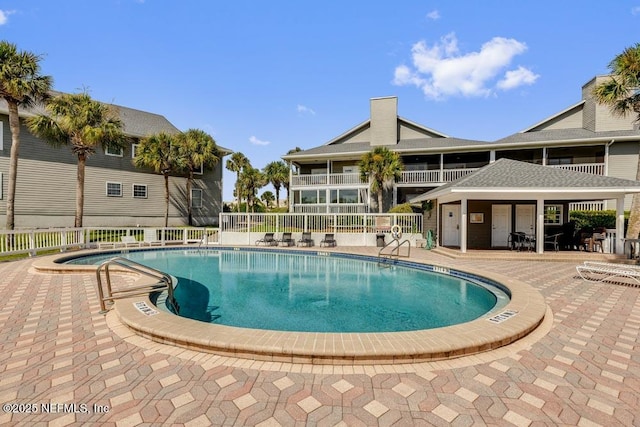 view of pool featuring a patio area