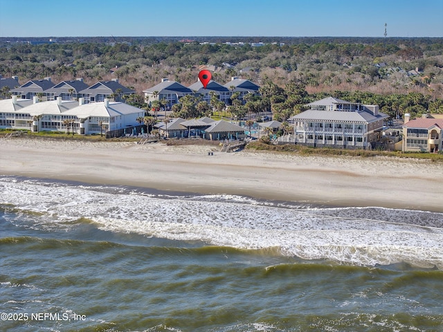 bird's eye view with a water view and a view of the beach