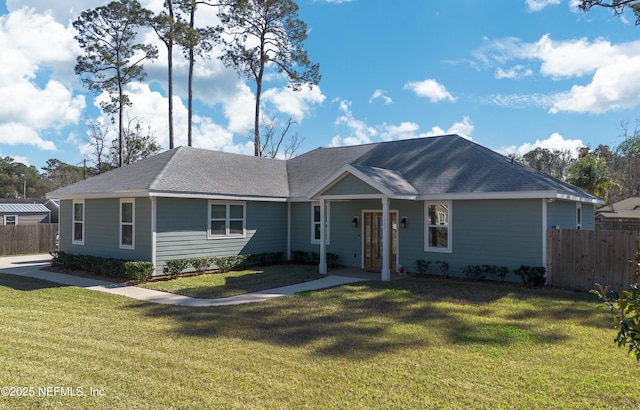 single story home featuring a front lawn