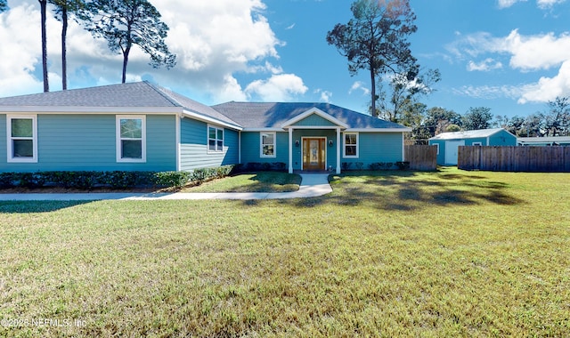 ranch-style home featuring a front lawn