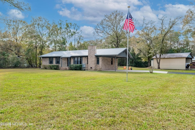 ranch-style home with a front yard and a carport