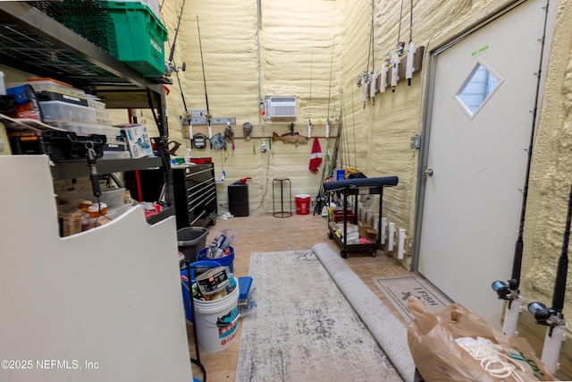 storage room featuring a wall mounted air conditioner