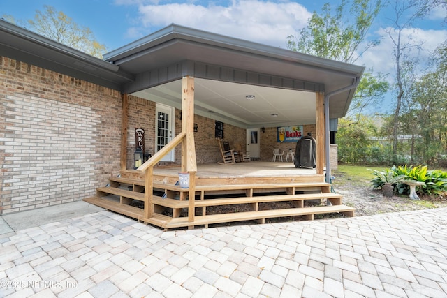 view of patio featuring a wooden deck