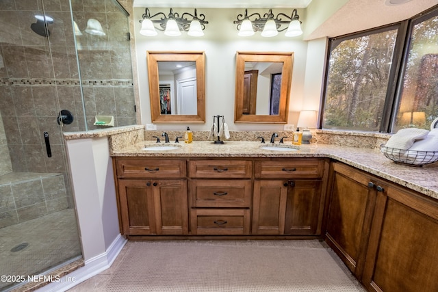 bathroom featuring an enclosed shower and vanity