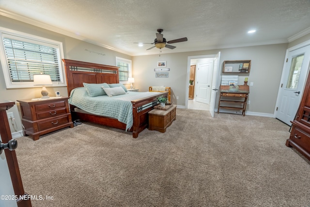 carpeted bedroom with ceiling fan, a textured ceiling, and crown molding