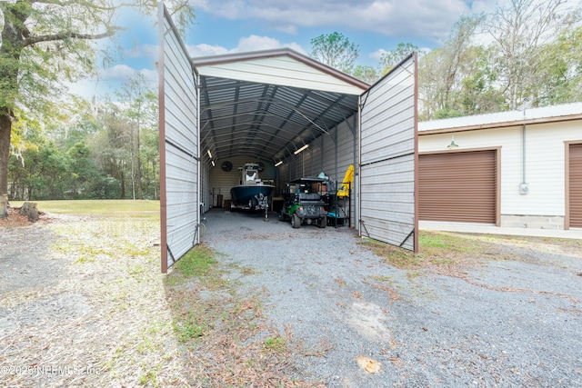 view of car parking with a garage and a carport