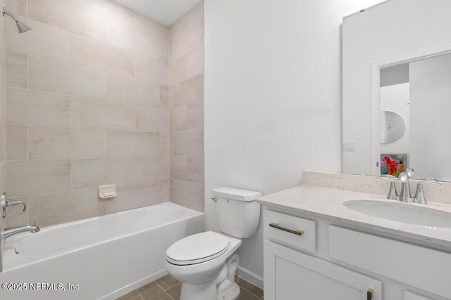 full bathroom featuring toilet, vanity, and tiled shower / bath