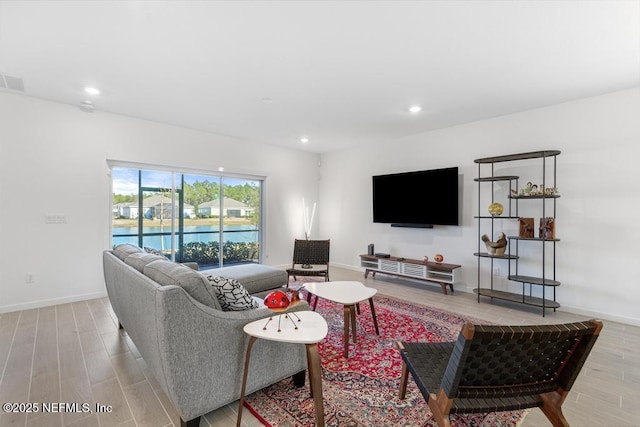 living room with light hardwood / wood-style flooring