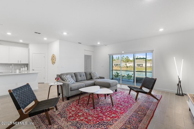 living room with light hardwood / wood-style flooring