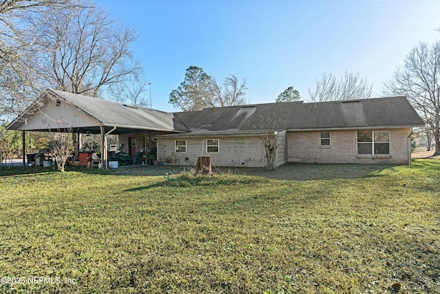 rear view of house featuring a yard