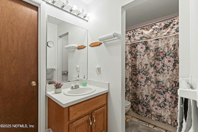 bathroom featuring toilet, tile patterned flooring, a textured ceiling, a shower with curtain, and vanity