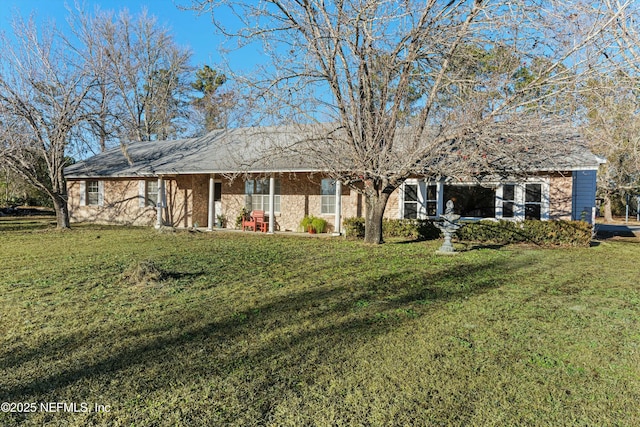 ranch-style home featuring a front yard