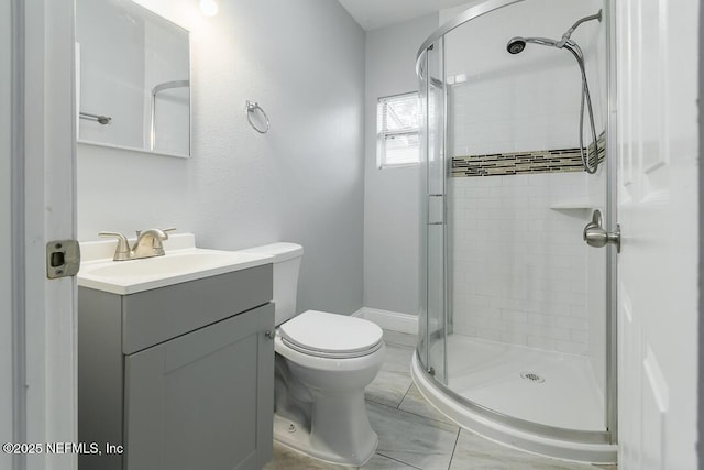 bathroom with toilet, a shower with door, and vanity