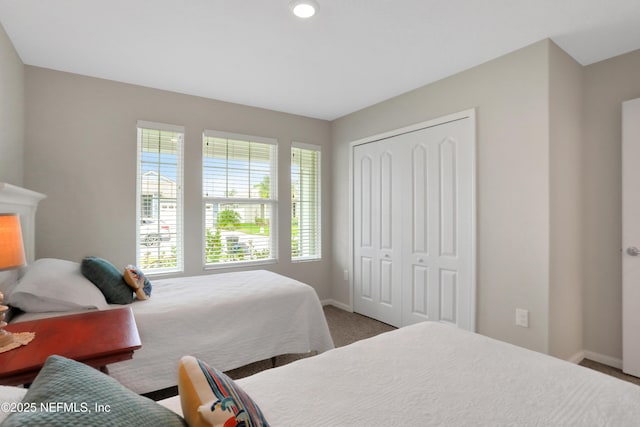 carpeted bedroom featuring a closet