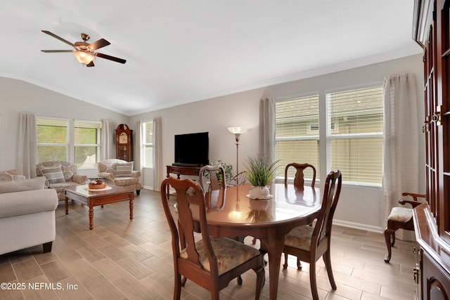 dining area featuring ceiling fan, lofted ceiling, and crown molding