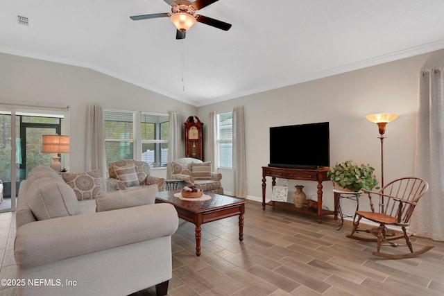 living room with vaulted ceiling, ceiling fan, and ornamental molding