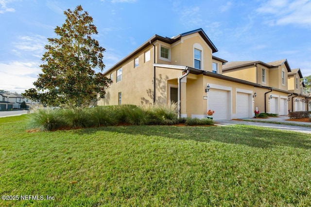 view of front of property featuring a front lawn and a garage