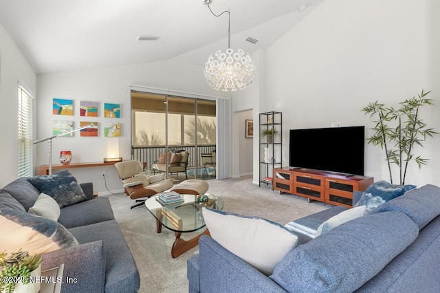 living room featuring lofted ceiling, light carpet, and a notable chandelier